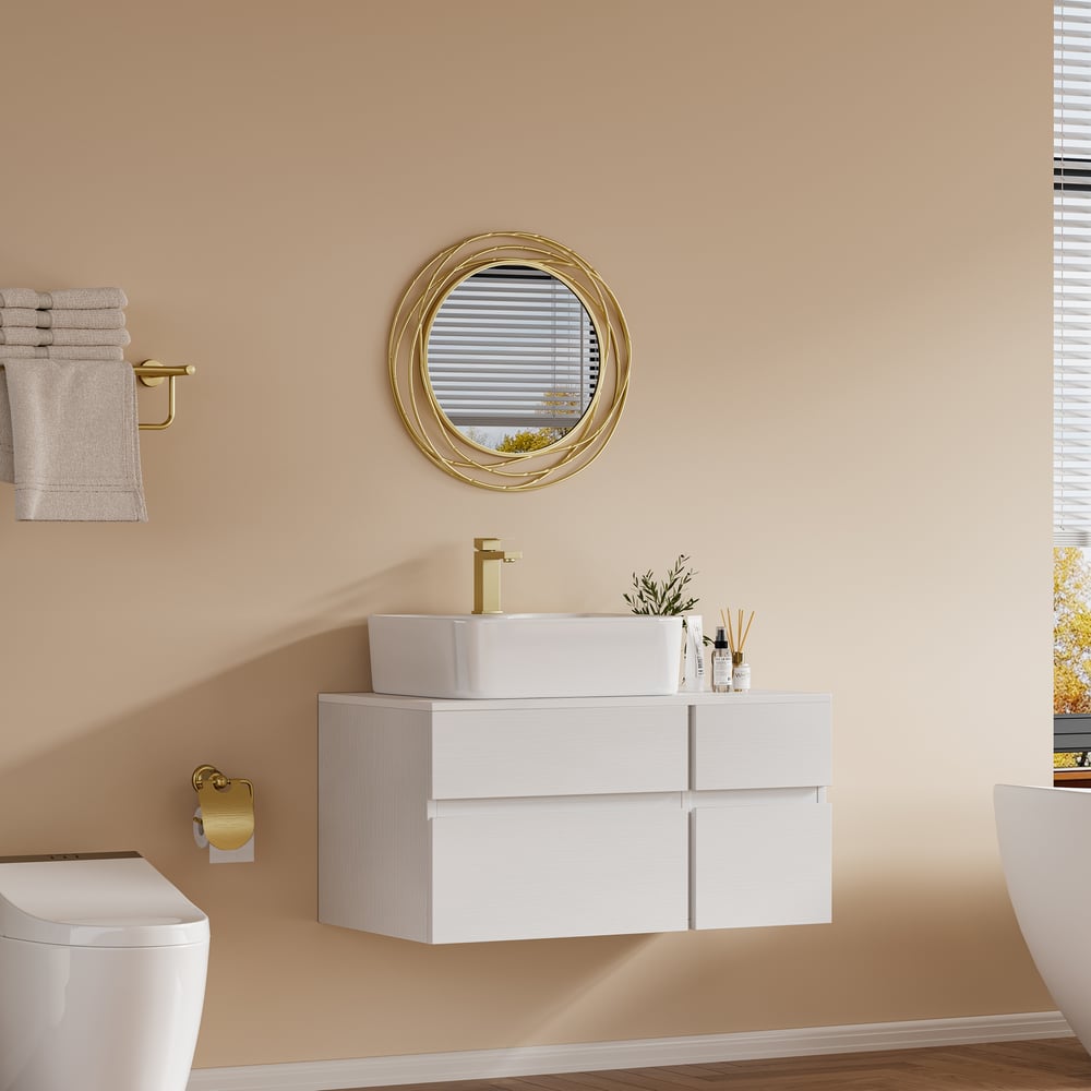 Bathroom interior with a white vanity, round mirror, and toilet.