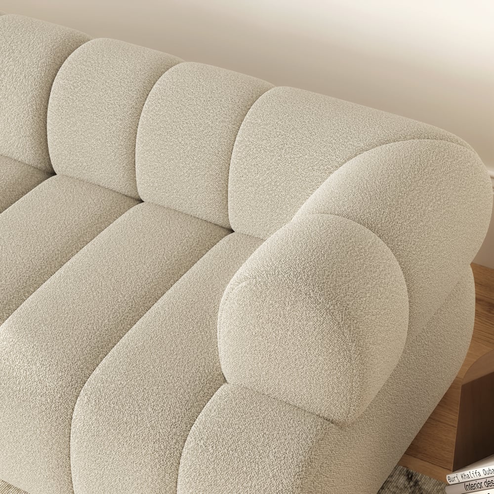 Close-up of a textured beige headboard on a bed with wooden frame.