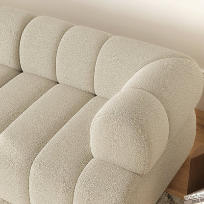 Close-up of a textured beige headboard on a bed with wooden frame.