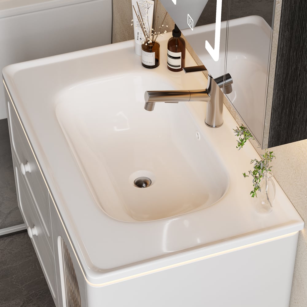 Bathroom sink with faucet and decorative items on a countertop
