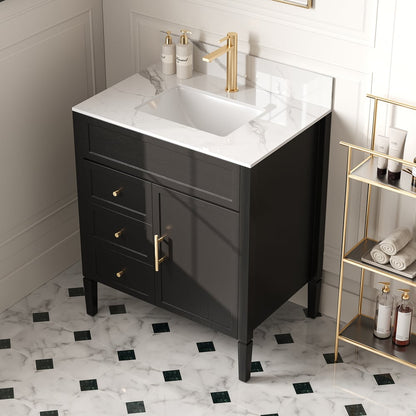 Bathroom vanity with white countertop, gold fixtures, and black floor tiles.