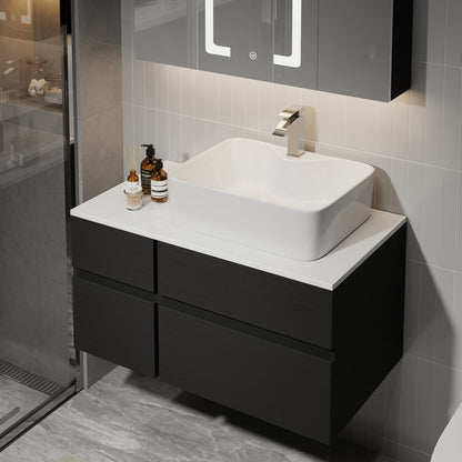 Bathroom vanity with white sink and black cabinets in a modern bathroom setting.