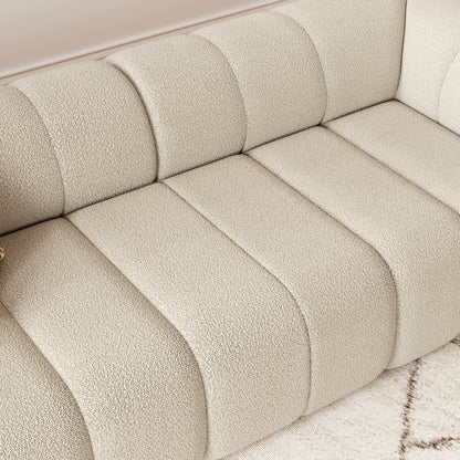 Close-up of a textured beige sofa with a soft, plush finish.