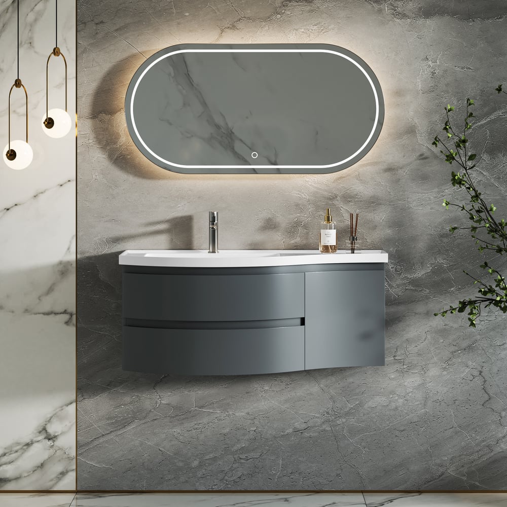 Bathroom vanity with mirror and sink against a marble wall