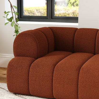 Brown sofa in a room with a window and plant