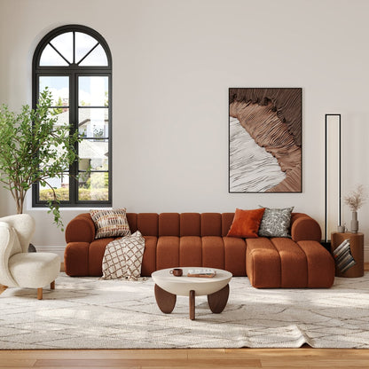 Modern living room with a brown sectional sofa, coffee table, and decorative pillows.