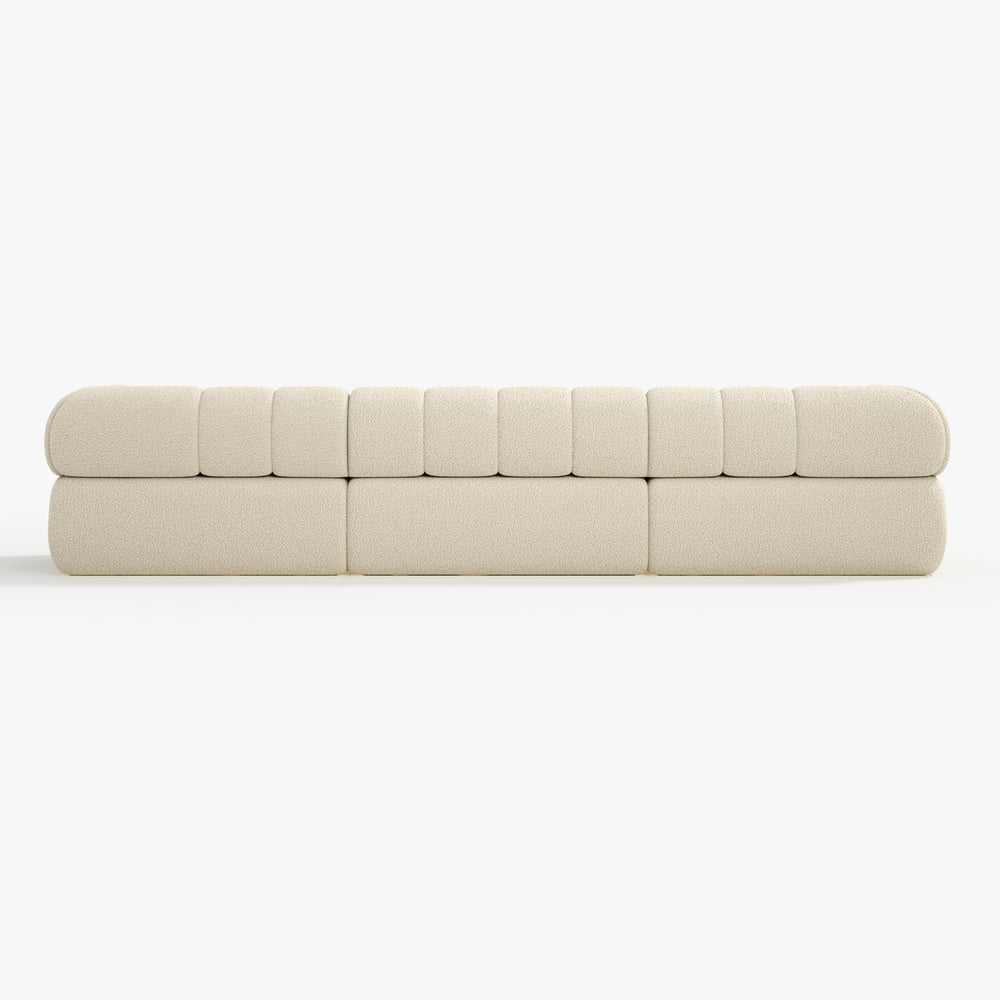 Beige sofa with a quilted design on a white background