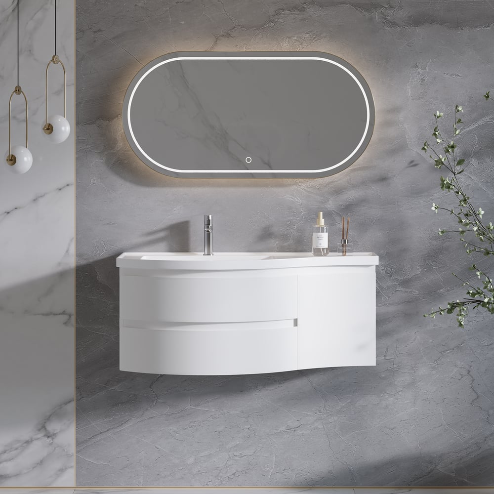 Bathroom vanity with illuminated mirror on a gray marble wall.