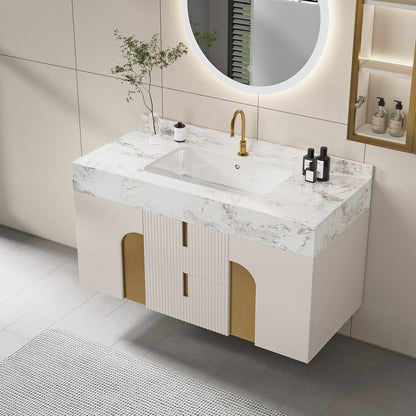 Bathroom vanity with marble countertop and gold fixtures in a modern bathroom setting.