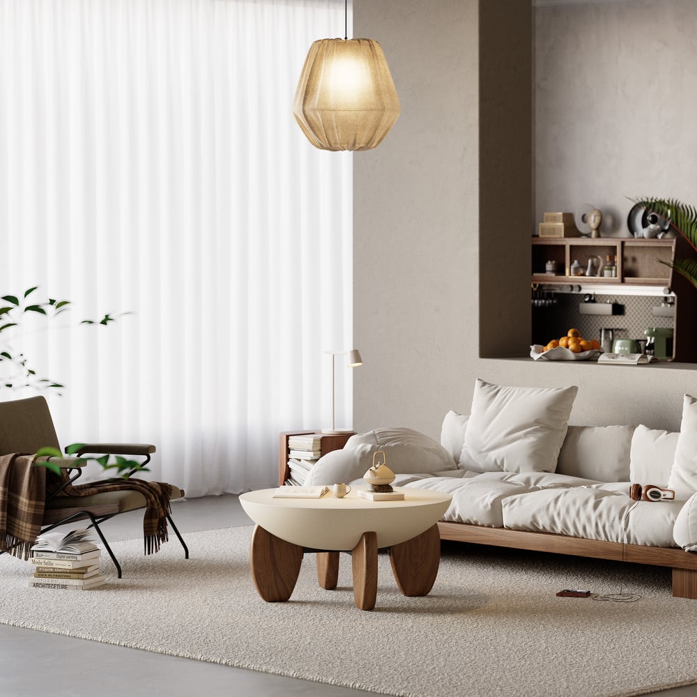 Modern living room with a sofa, coffee table, and decorative items.