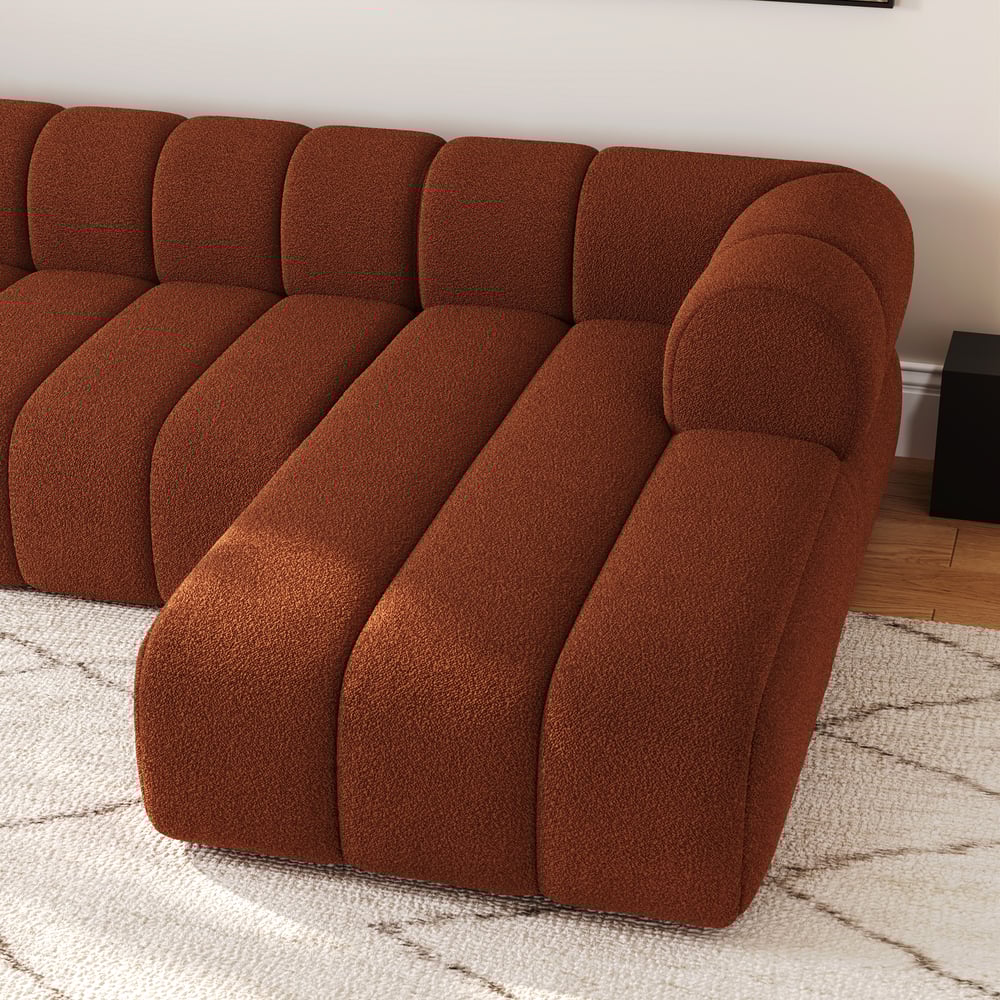 Brown sofa in a living room setting with a neutral background