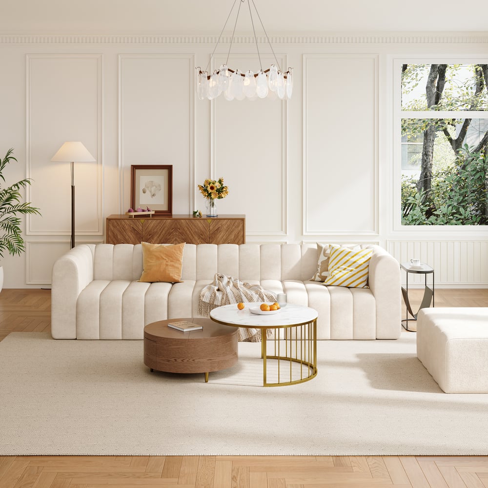 Modern living room with an Off white sofa, wooden coffee table, and decorative elements.