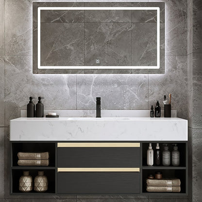 Bathroom vanity with a large mirror above it, featuring various toiletries on a gray tiled wall.