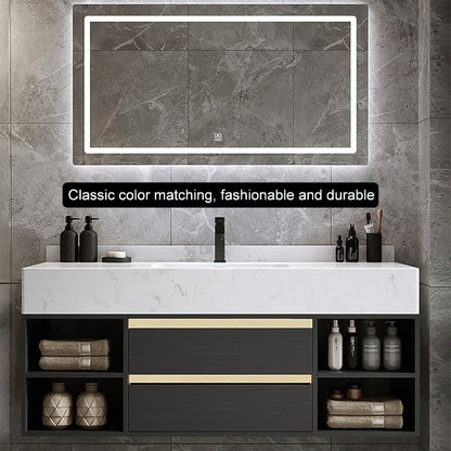 Bathroom vanity with illuminated mirror, black cabinets, and various toiletries.