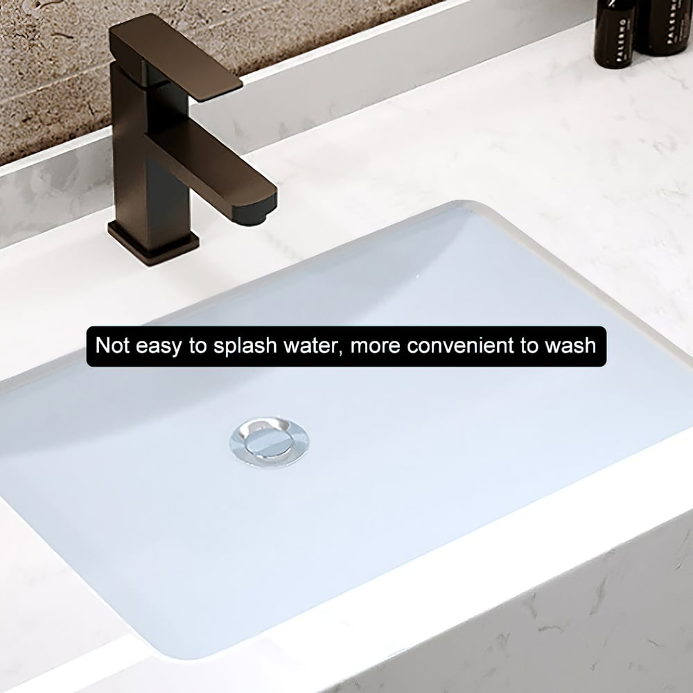 Bathroom sink with bronze faucet on a white countertop