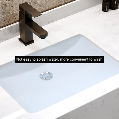 Bathroom sink with bronze faucet on a white countertop