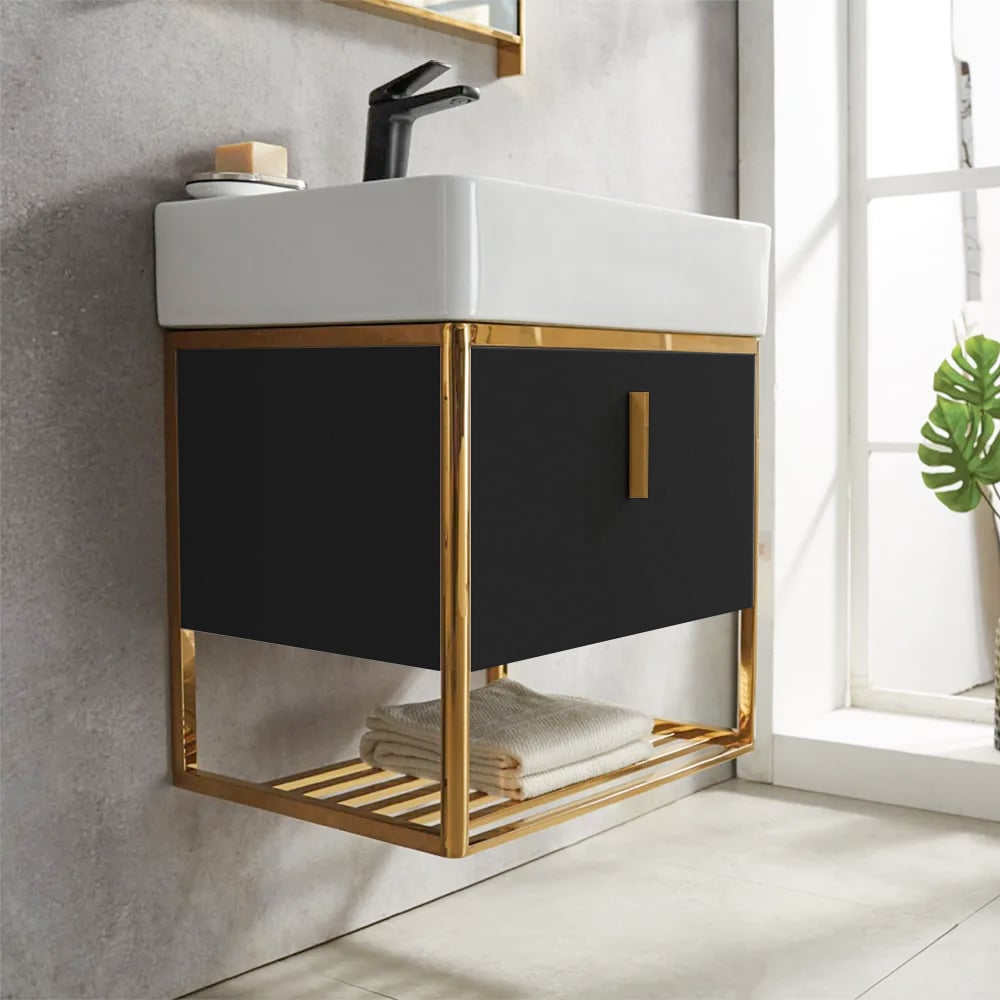 Bathroom vanity with black cabinet and gold frame in a bright bathroom setting.