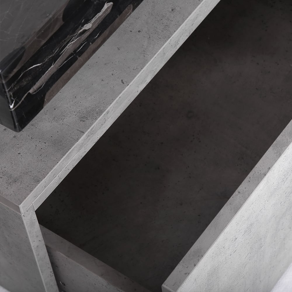 Close-up of a concrete surface with a black object on it