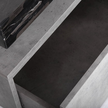 Close-up of a concrete surface with a black object on it