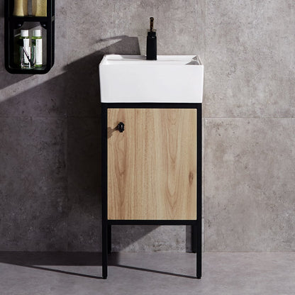 Bathroom vanity with wooden cabinet and white sink against a gray tiled wall.