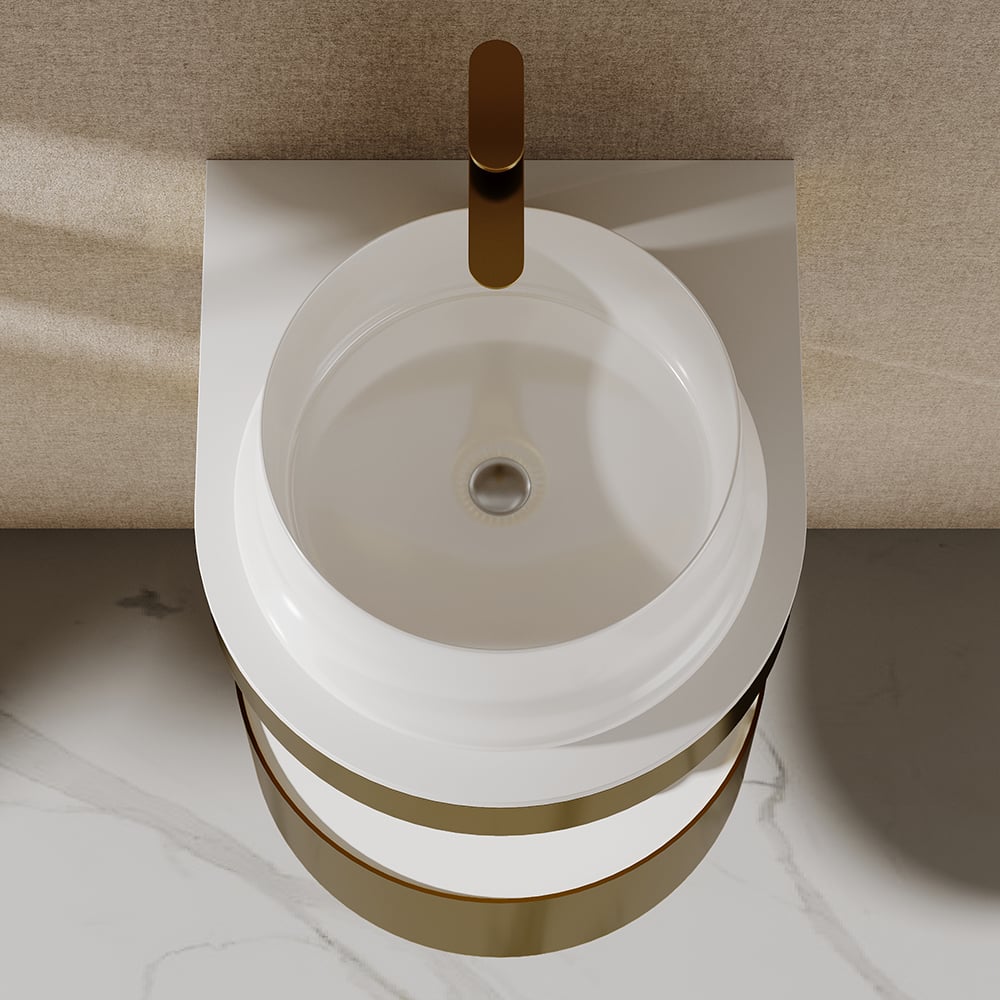Modern white sink with gold faucet and trim in a bathroom setting