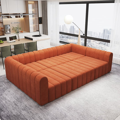 Orange sectional sofa in a modern living room with a kitchen in the background.