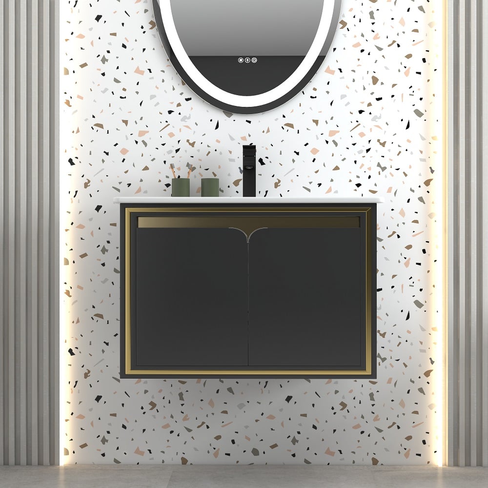 Bathroom vanity with black cabinet and round mirror on terrazzo-patterned wall.