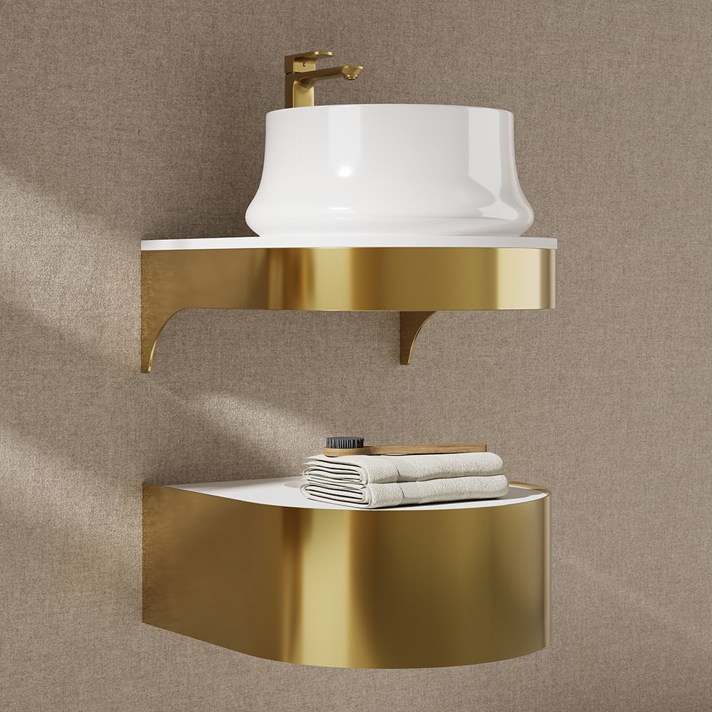 Wall-mounted sink with gold bracket and white basin against a beige wall.