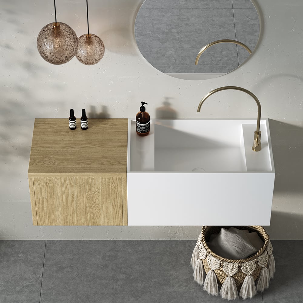 Bathroom vanity with white sink, wooden cabinet, and decorative elements.