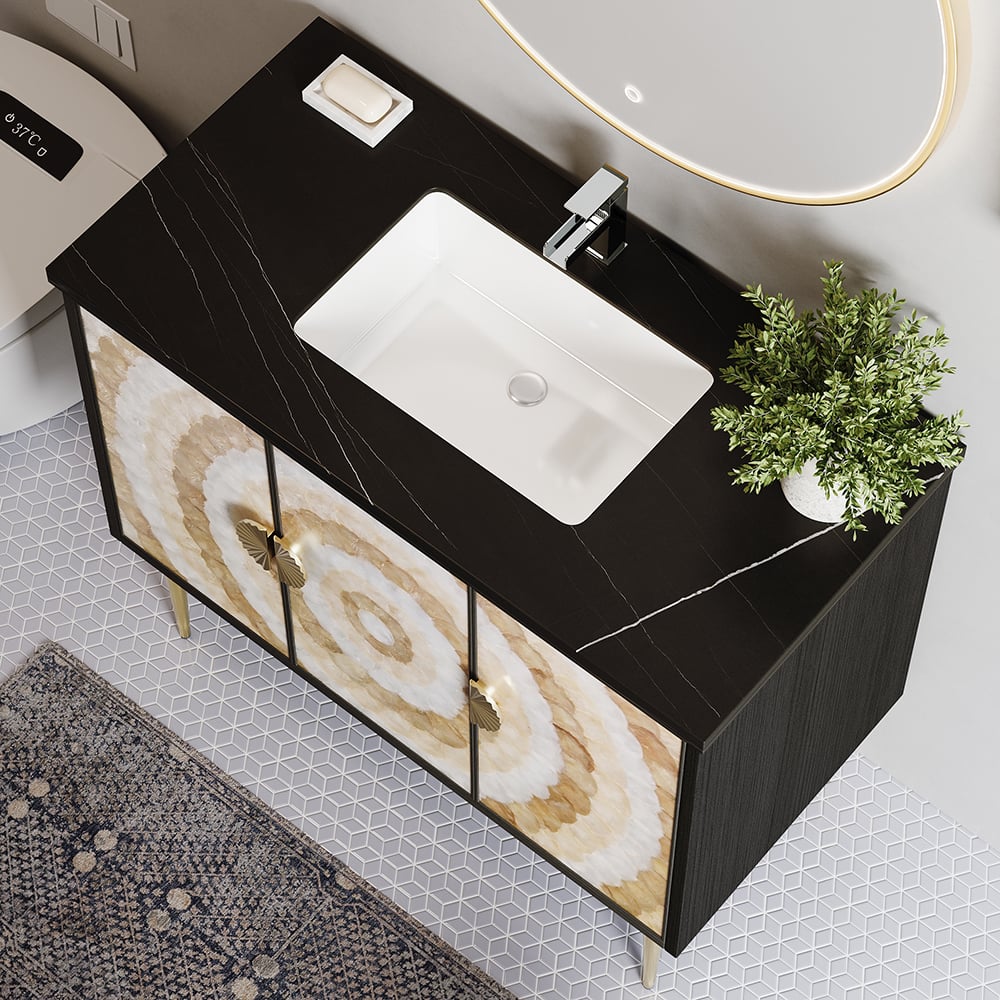 Bathroom vanity with marble-patterned doors and a white sink.