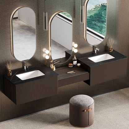 Bathroom vanity with three mirrors and a small ottoman on a textured wall.