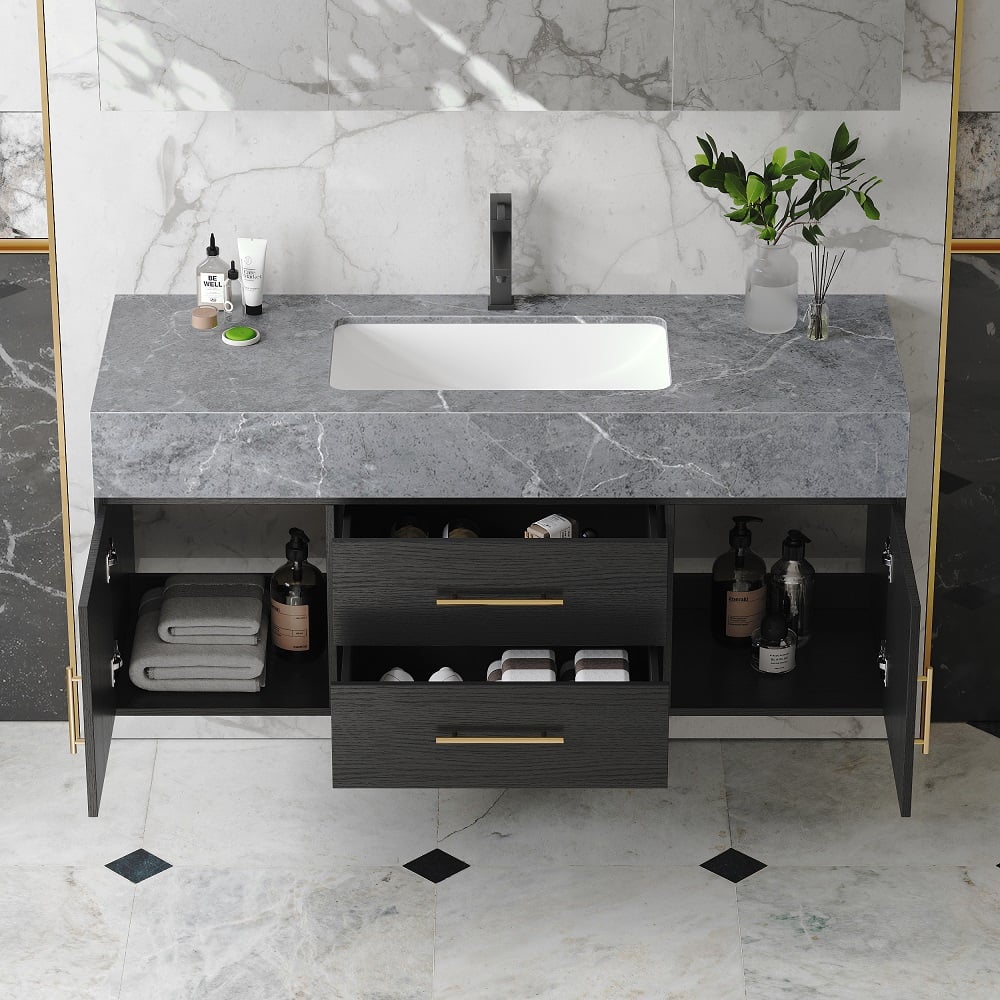 Bathroom vanity with marble countertop and floor, featuring a sink and storage drawers.
