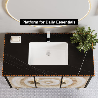 Black marble countertop with a white sink and decorative elements on a tiled wall background.
