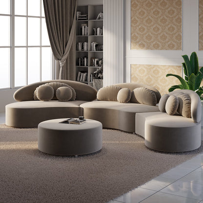 Modern living room with khaki sectional sofa and round ottoman.
