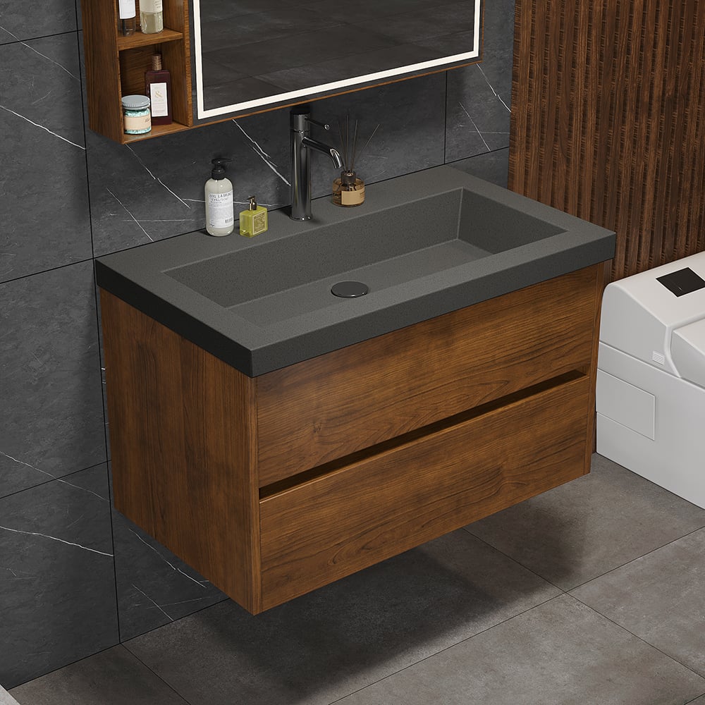 Bathroom vanity with dark gray countertop and wooden cabinet