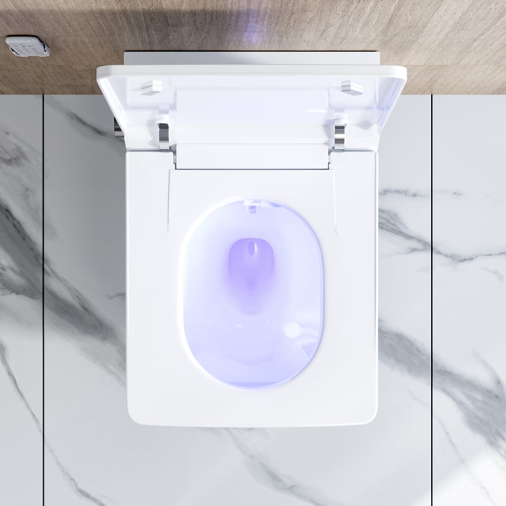 White electronic device with a purple light on a marble surface