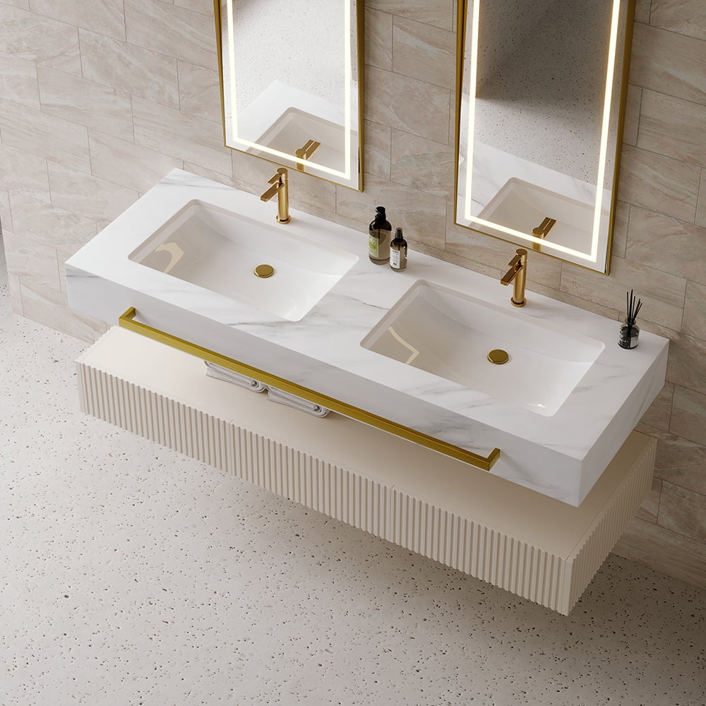 Bathroom vanity with dual sinks, gold fixtures, and mirrors in a tiled bathroom.