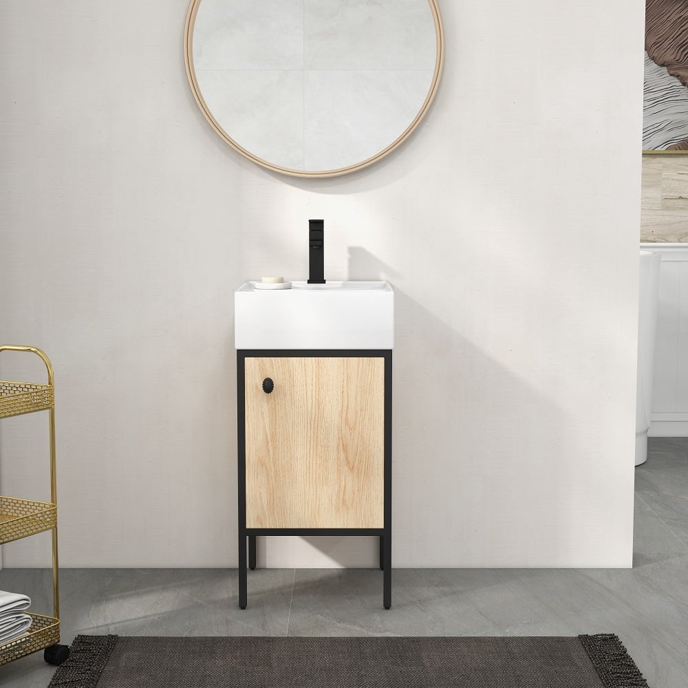 Bathroom vanity with wooden cabinet and white countertop against a light gray wall.