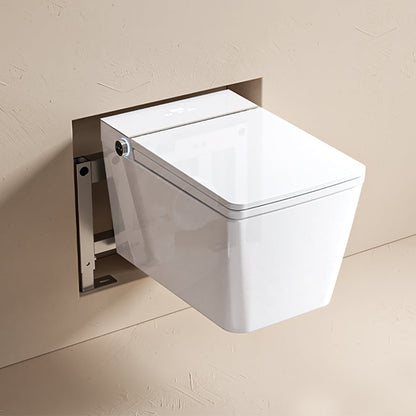 Wall-mounted white toilet bowl with silver flush mechanism on a beige wall.