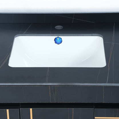 Rectangular white sink on a black tiled wall