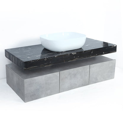 Bathroom vanity with black marble countertop and white sink on a white background