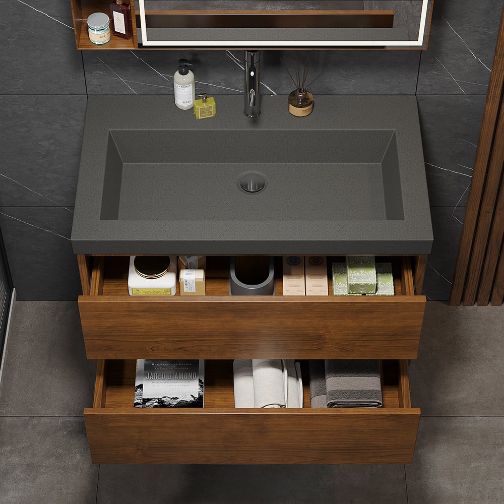 Bathroom vanity with dark gray sink and wooden cabinets.