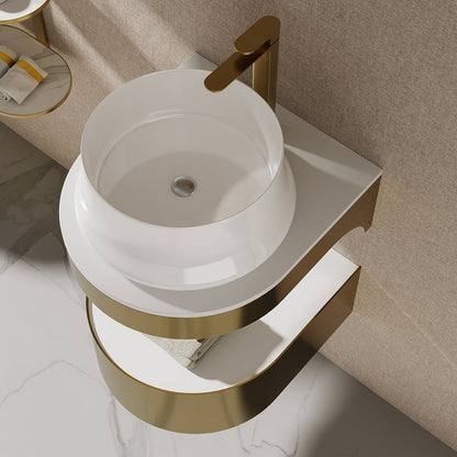 Bathroom sink with gold faucet and trim against a beige wall.