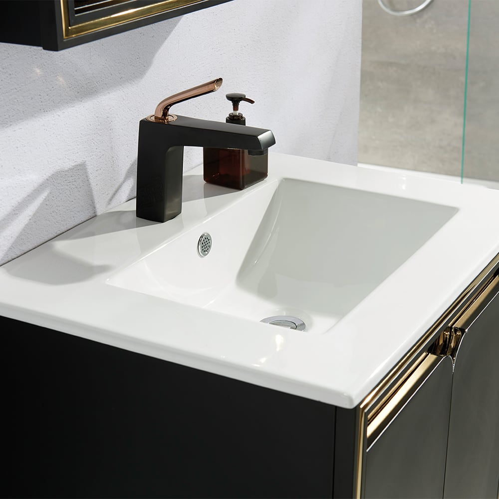 Bathroom sink with black faucet and soap dispenser on a white countertop.