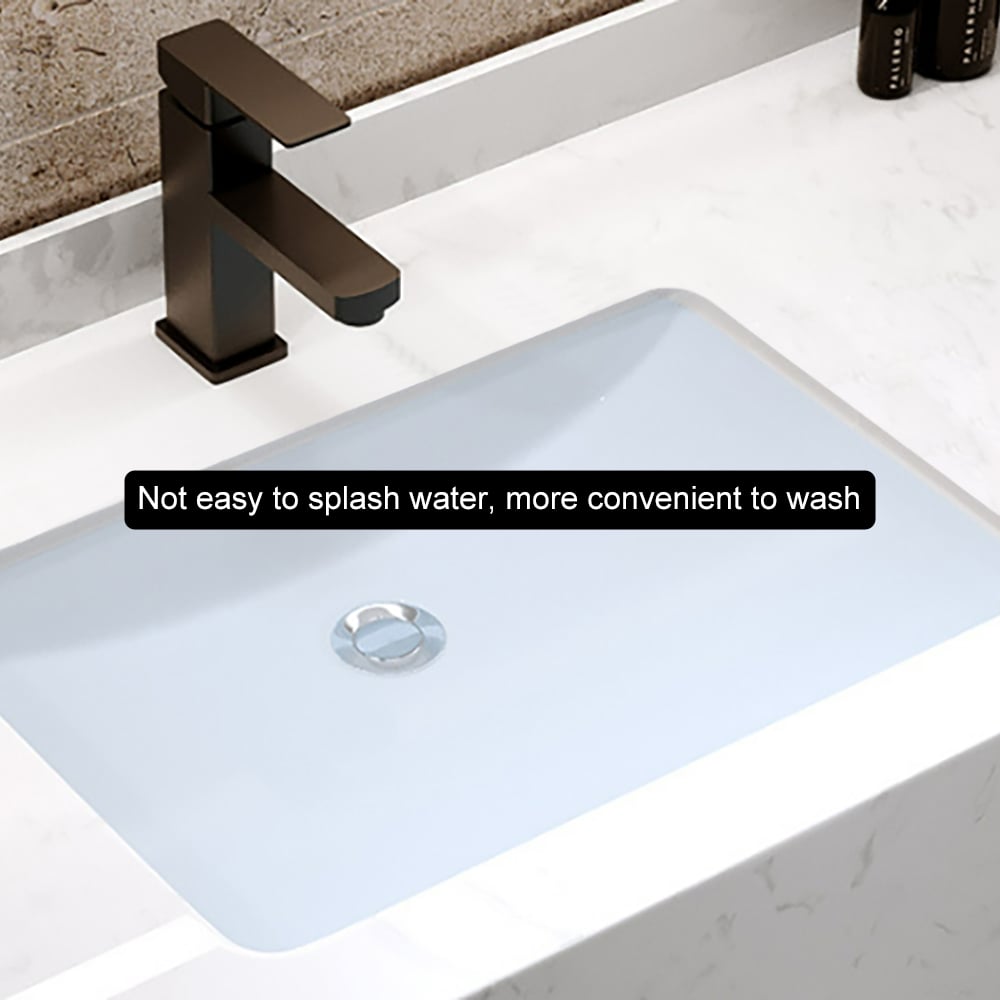 Bathroom sink with bronze faucet on a white countertop