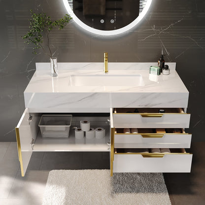 Bathroom vanity with marble countertop, gold fixtures, and open drawer revealing storage items.