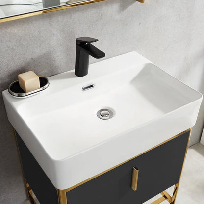 White sink with black faucet and soap on a gray countertop