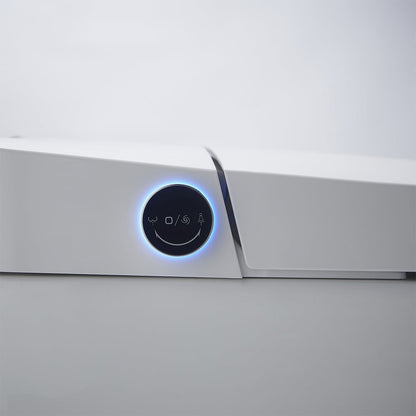 Close-up of a modern electronic device with a control panel featuring symbols and a blue light.