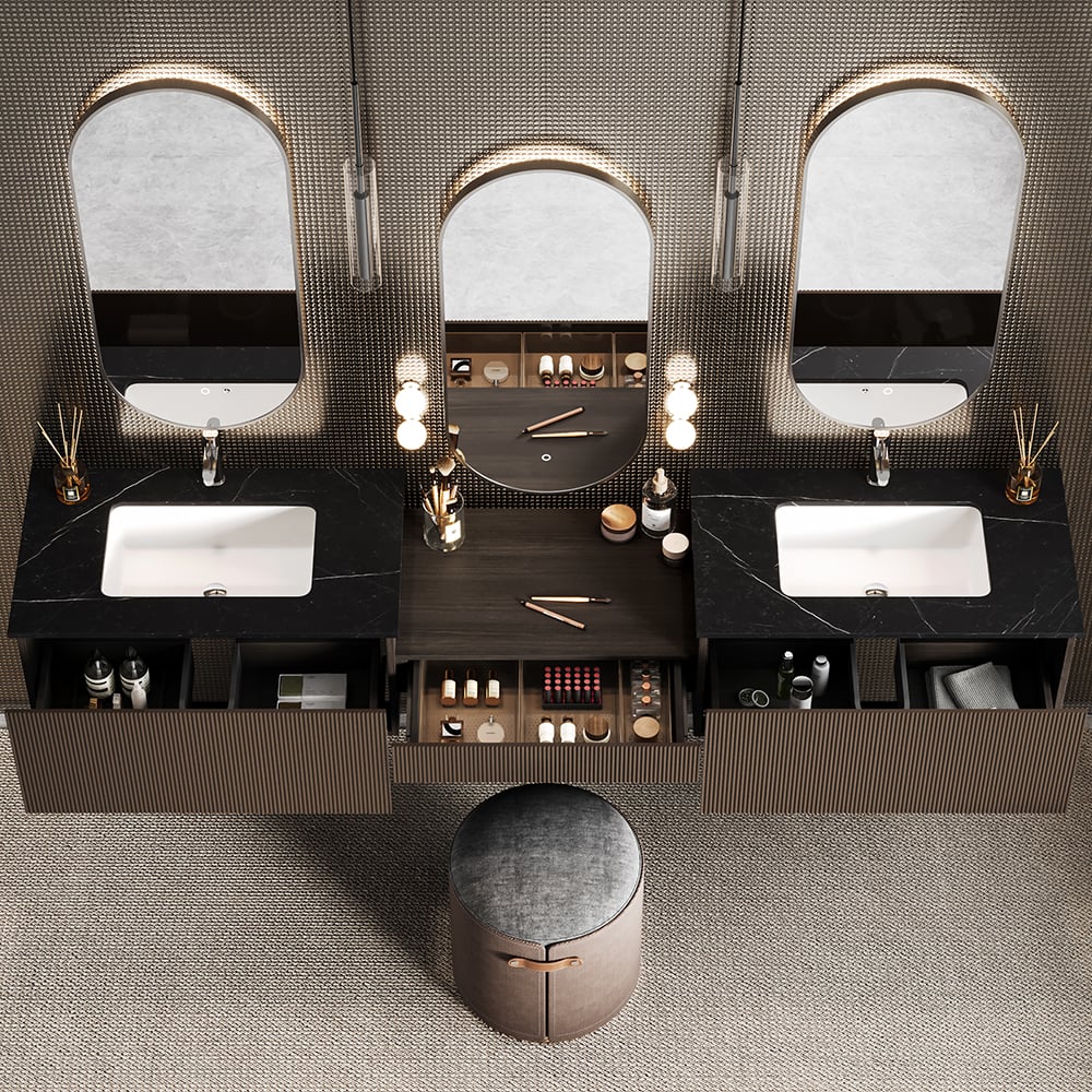 Bathroom vanity with three mirrors, sinks, and various toiletries on a textured wall background.