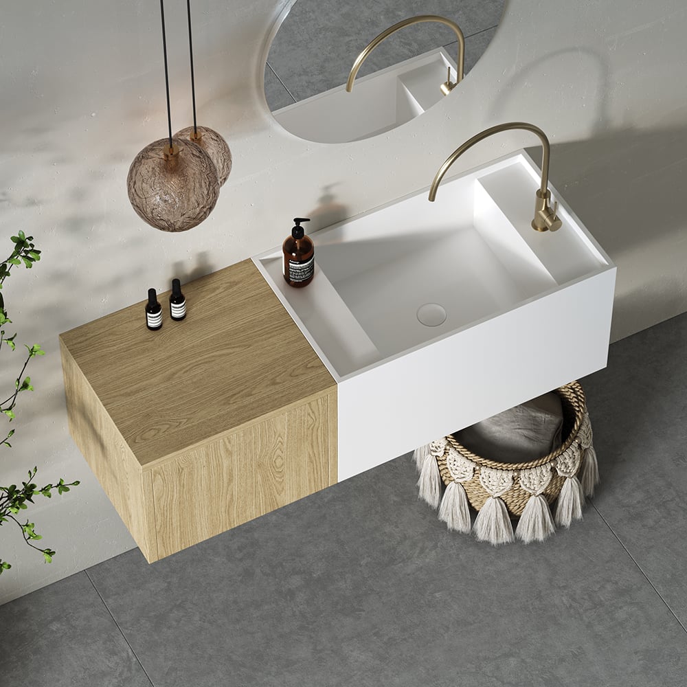 Bathroom setup with a white sink, wooden cabinet, and decorative elements.